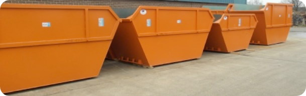 Row of open skips at 2 recycling